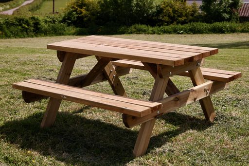 Heavy-duty wooden picnic table on grass